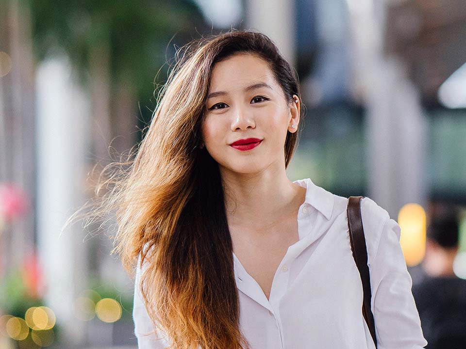 Asian girl smiling in the city