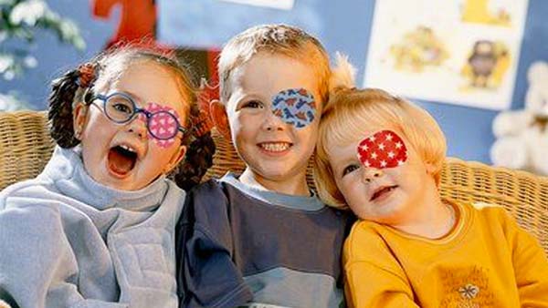 three children wearing eye patches to help fix amblyopia